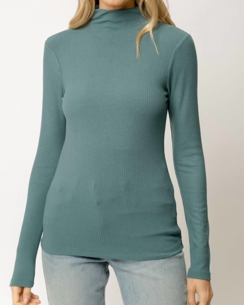 Front of a model wearing a size Large Ribbed Mock Neck Turtleneck Top in Teal in Teal by mystree. | dia_product_style_image_id:333910